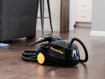 Image of the Poulan Pro PP350 side angle on hardwood floor in a living room. The image contains a wrapped up hose with the jet nozzle attachment on top of the steam cleaner.
