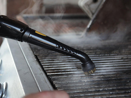 mage of the PP350 steam cleaner being used on a grill grate for a hot grill highlighting the features of a brass brush head and getting the tough spots and hard to get materials as well as ease of use.