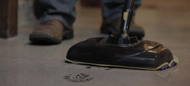 Image showing mop head cleaning a floor with a boot print showing the power of our steam.