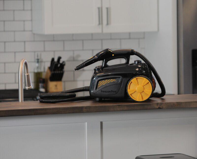 Lifestyle of a Poulan Pro PP350 Canister Steam System on a wood counter